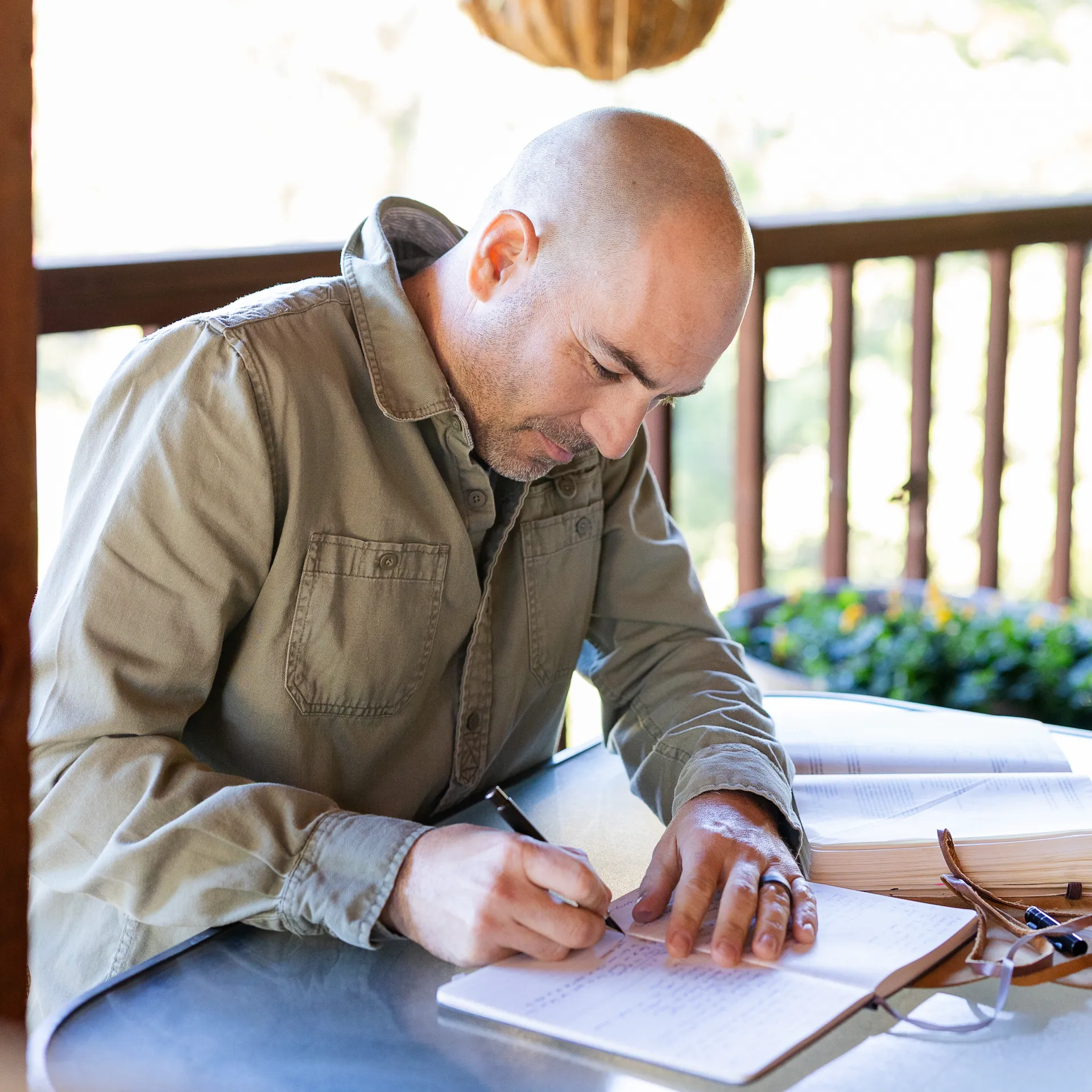 a weathered hand holding a staff