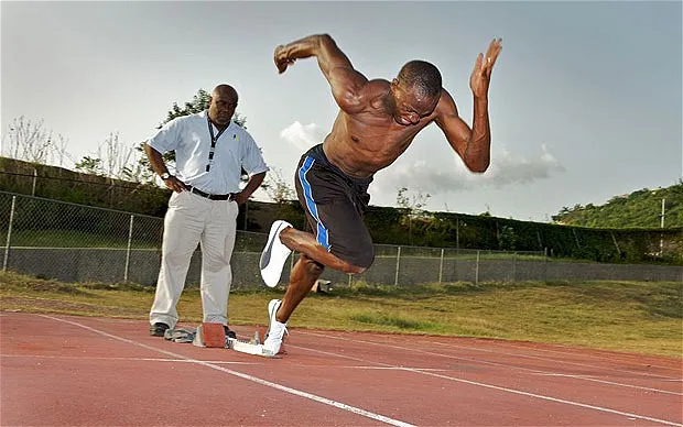 Usain Bolt with Coach Glen Mills