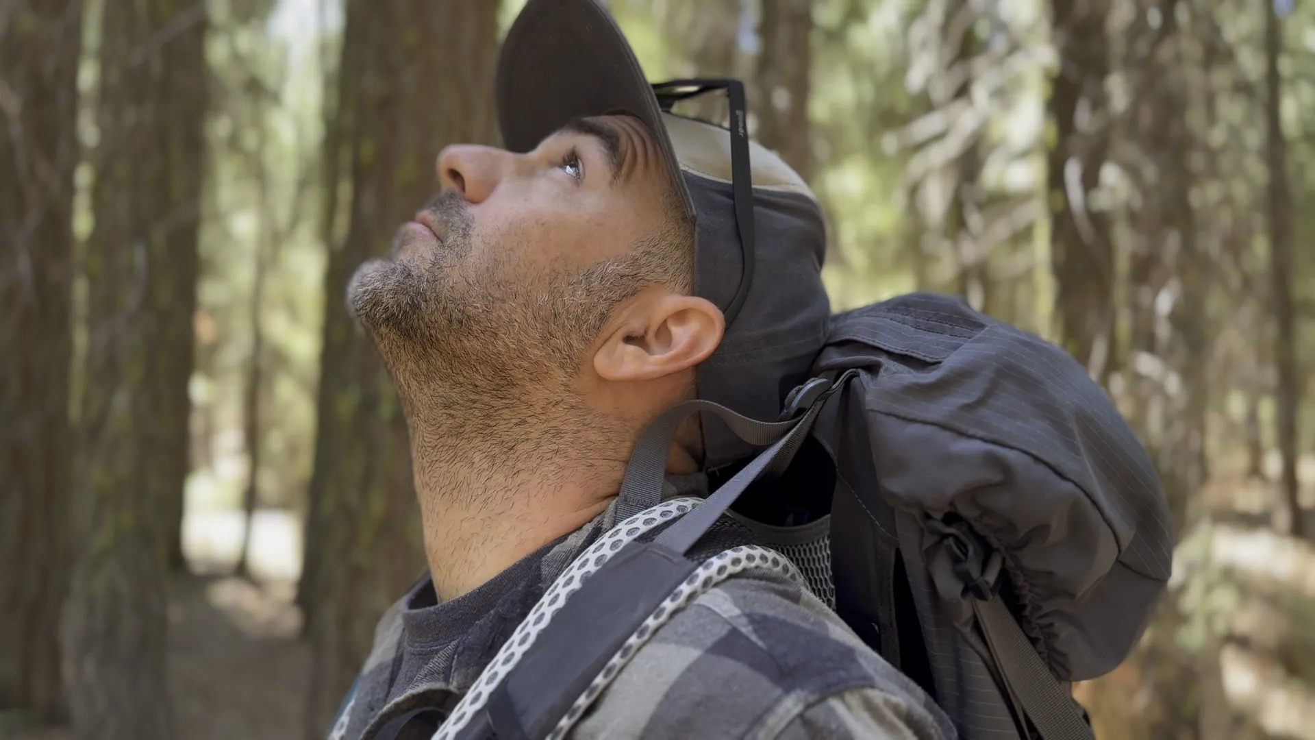 A close-up of a man’s boot stepping onto a rocky mountain trail, symbolizing the start of an intentional journey.