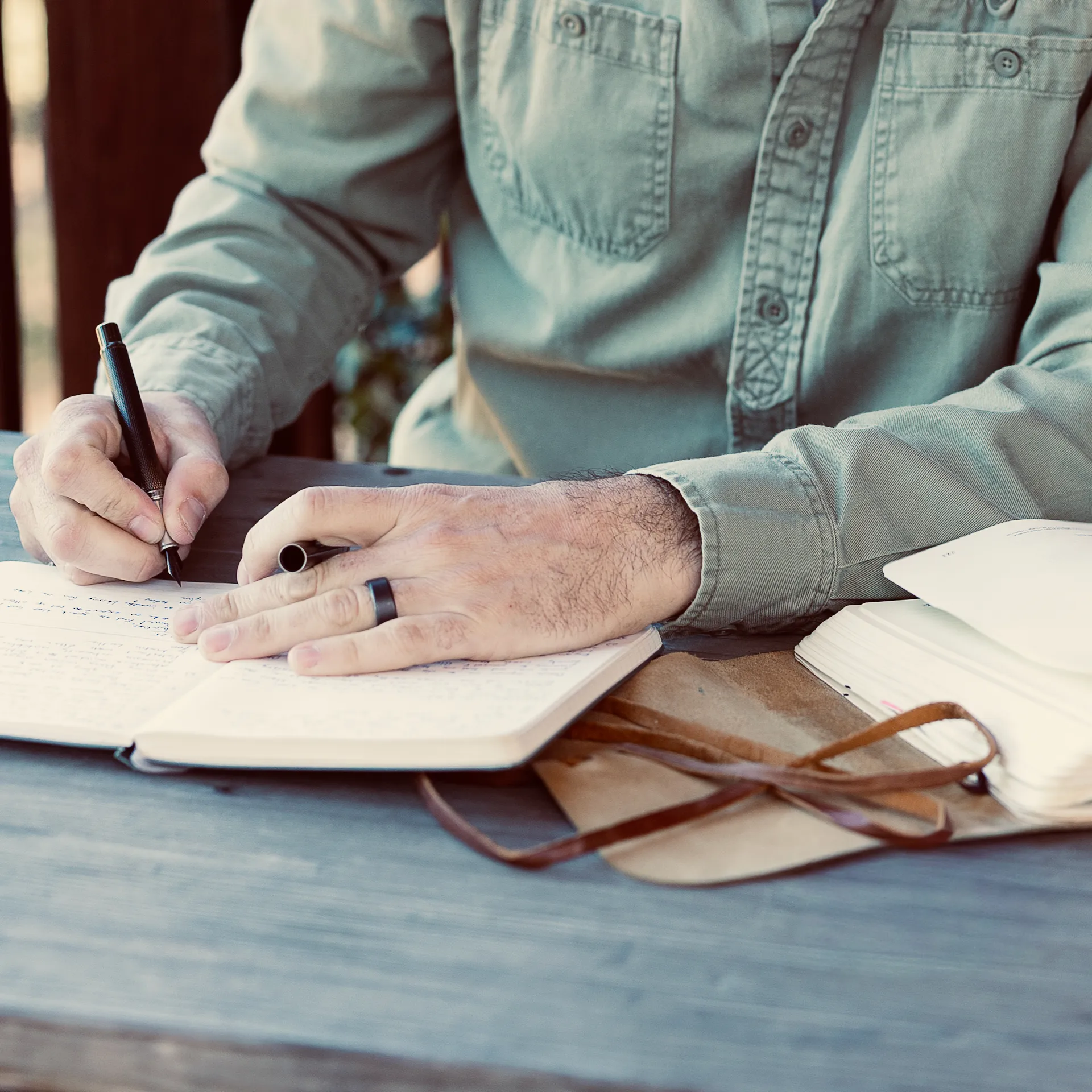 A man studying, journaling, and self-reflecting