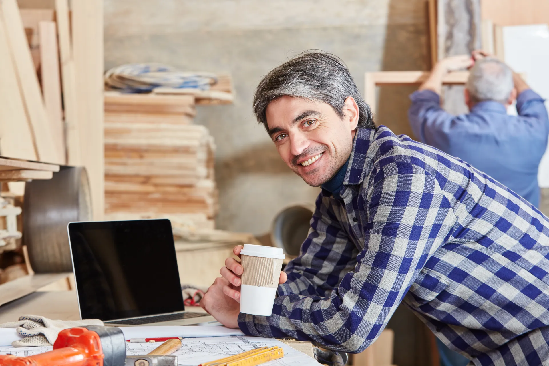 A business owner celebrating a major business success, feeling empowered and financially secure.