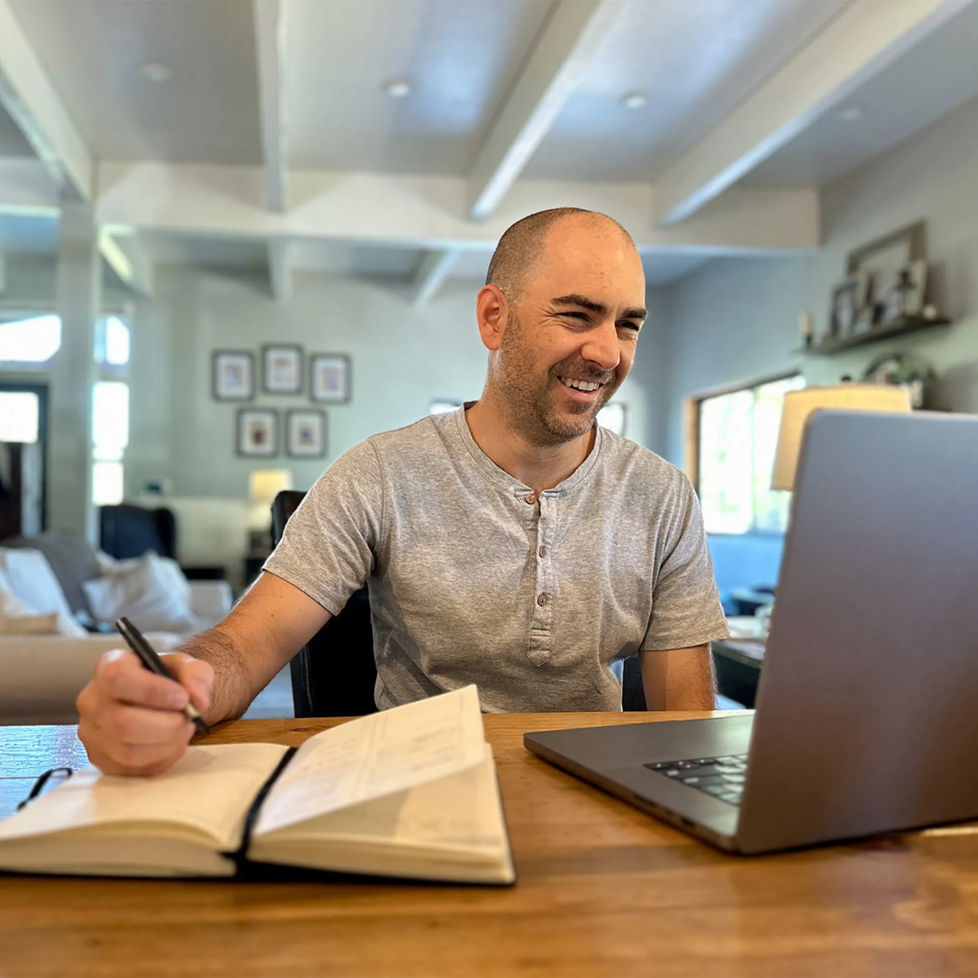 A business owner reviewing financial documents, focused on consistent growth and profitability.